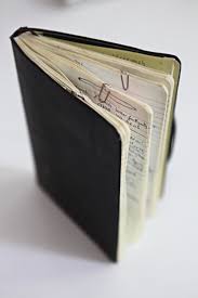A black leather notebook.