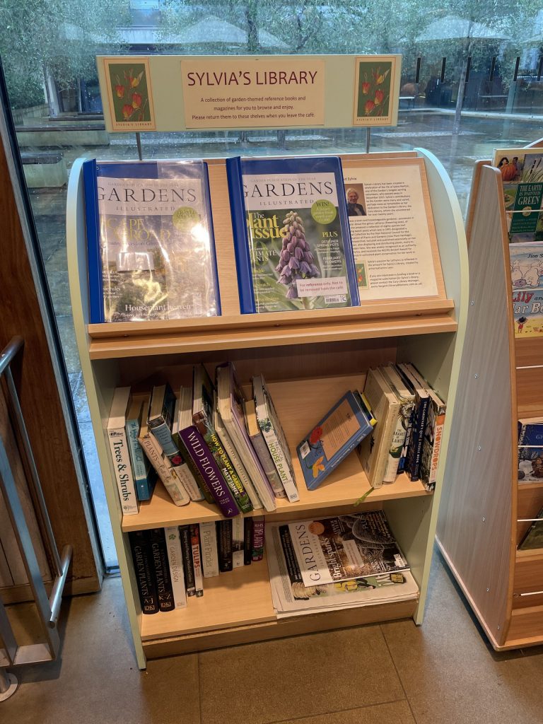 A small bookshelf with a range of gardening and botany books 