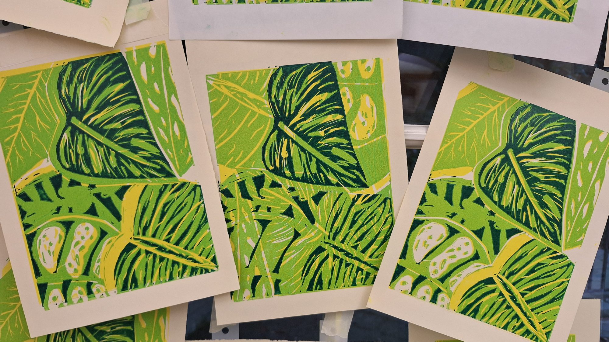 a linocut image of tree trunks